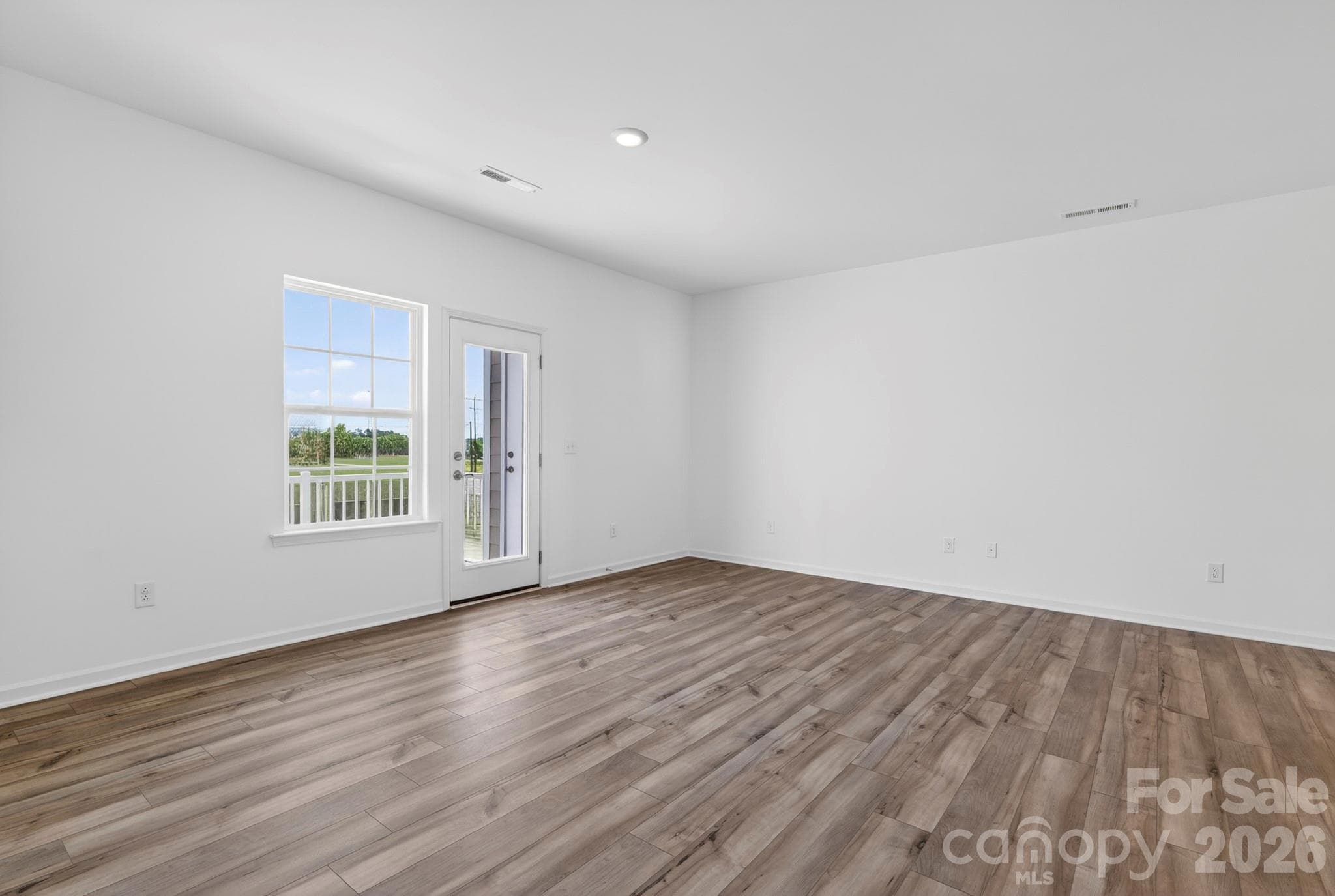 Family room leads to the covered balcony - 107 Nablus Trail, Mooresville
