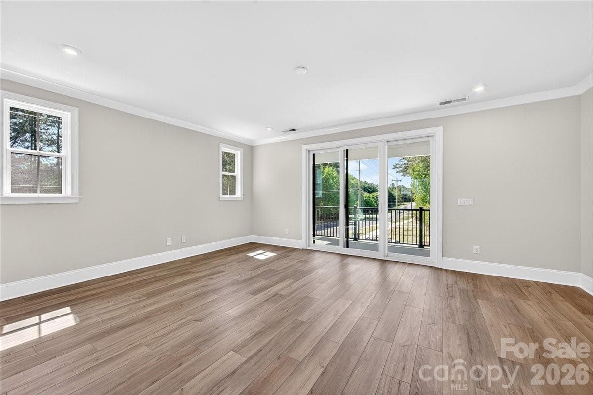 Light filled living room with access to the outdoor living - 12023 Elsa Lane, Charlotte