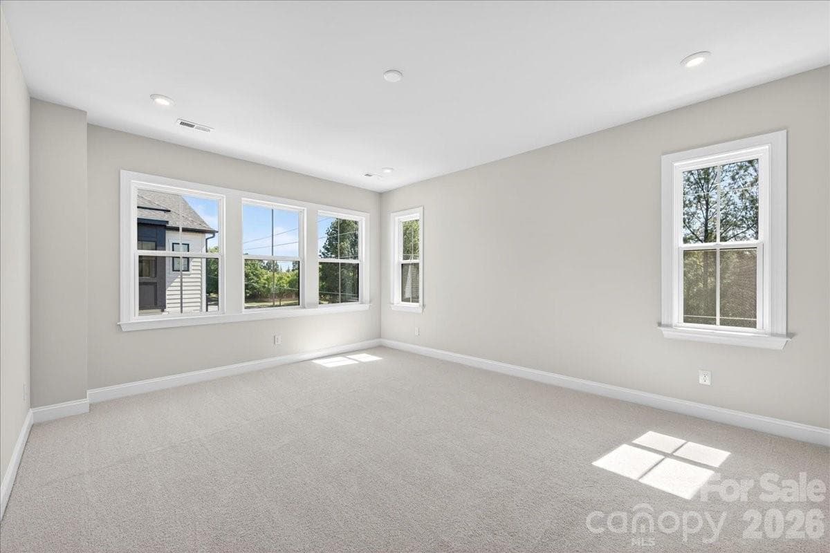 Light filled primary bedroom - 12023 Elsa Lane, Charlotte