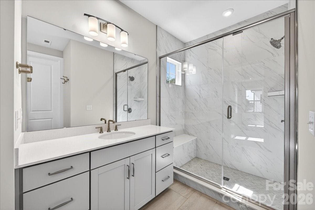 Dual vanity primary bathroom with tiled walk-in shower - 12023 Elsa Lane, Charlotte