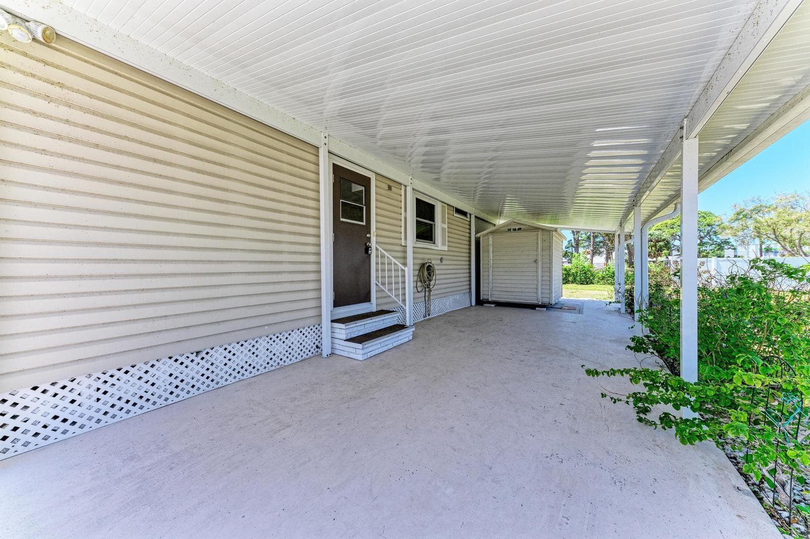 2-yr-old carport with shed for washer/dryer - 348 TROPIC DR, OSPREY