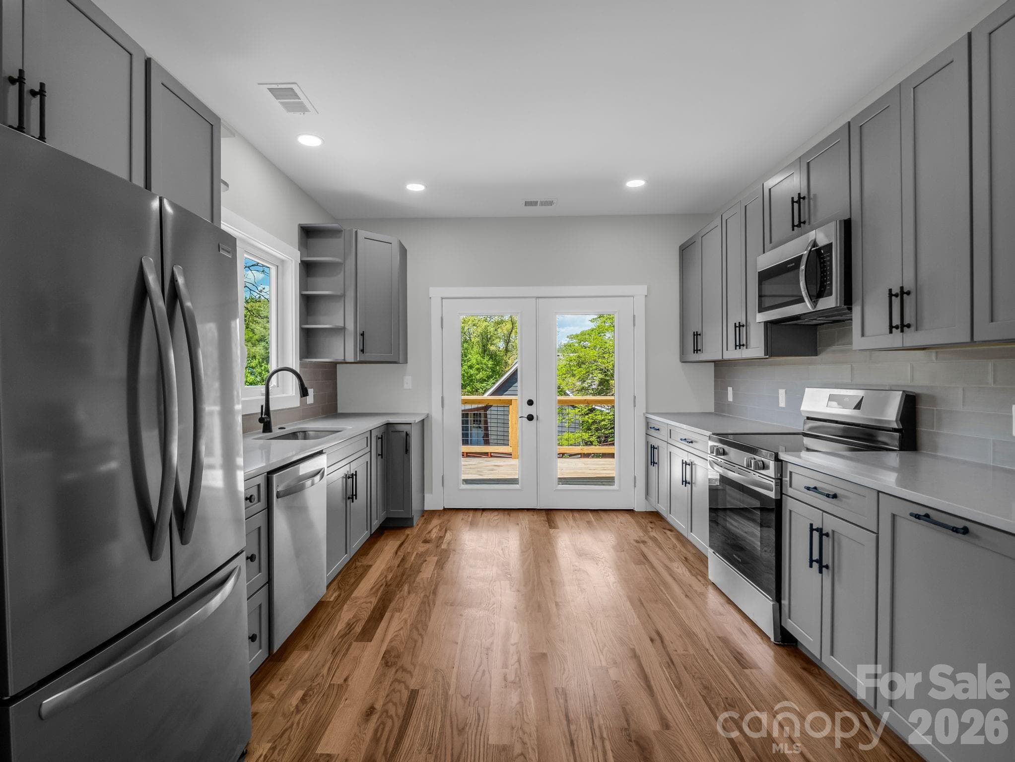 kitchen to french doors to deck - Main Floor - 18 Worley Place, Asheville