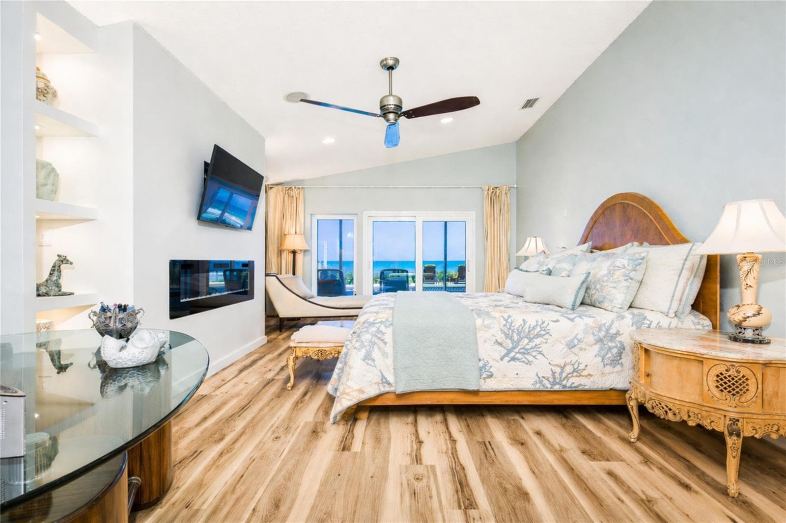 Primary suite with fireplace. - 1504 N ATLANTIC AVE, DAYTONA BEACH