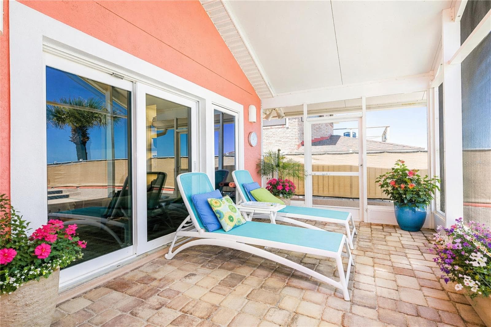 Covered screened porch. - 1504 N ATLANTIC AVE, DAYTONA BEACH