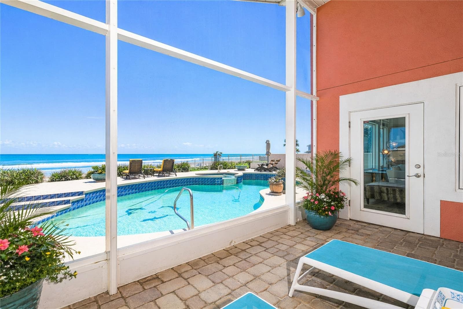 Screened in porch. - 1504 N ATLANTIC AVE, DAYTONA BEACH