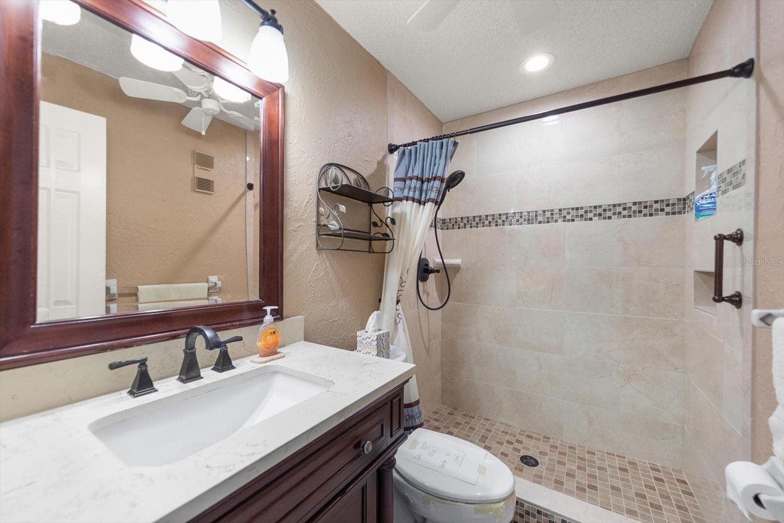 Primary bathroom tastefully updated - 5970 80TH ST N #411, ST PETERSBURG