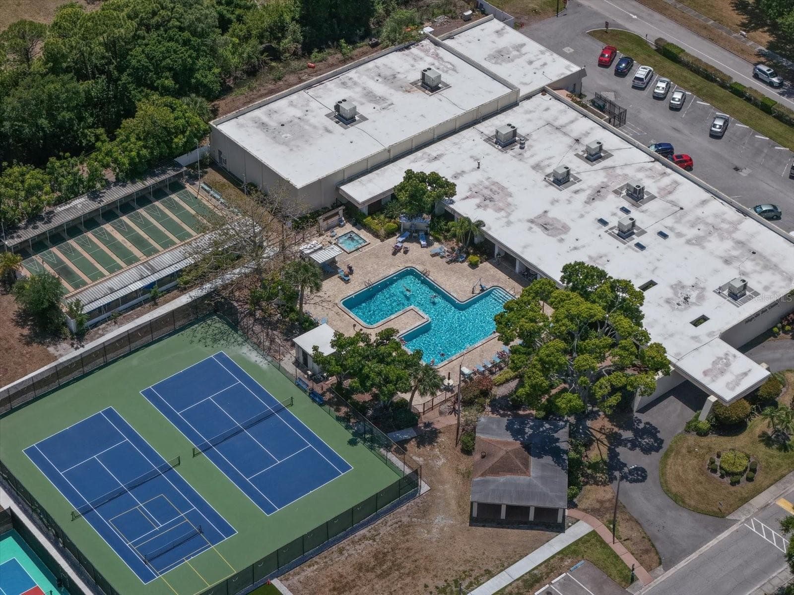 Magnolia clubhouse has the one of the fitness centers, shuffleboard, tennis courts and pickleball. This is where all the dances and get togethers are held. - 5970 80TH ST N #411, ST PETERSBURG
