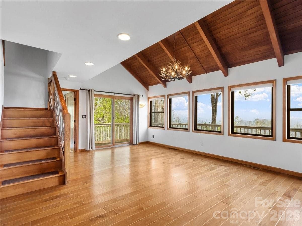 Vaulted ceiling with custom railing to upper level - 49 Slickrock Ridge Way S, Burnsville