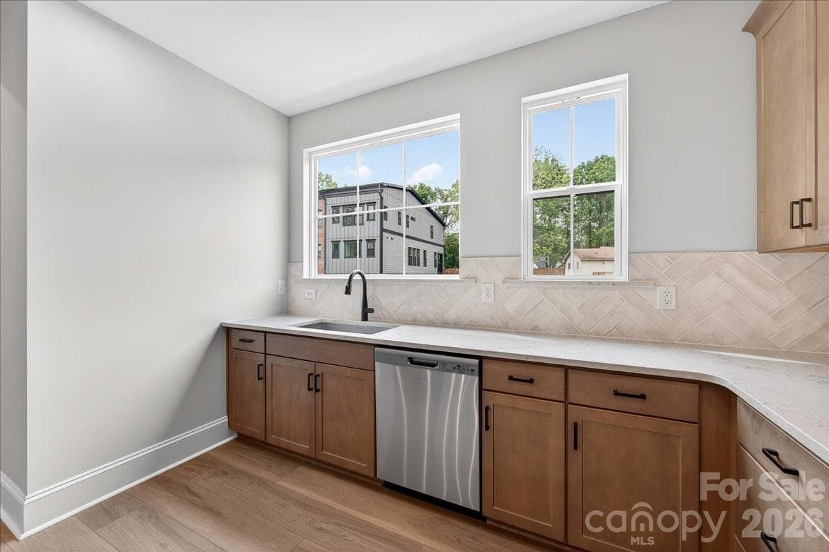Large single bowl stainless steel sink facing outside - 420 Old Town Village Road, Waxhaw
