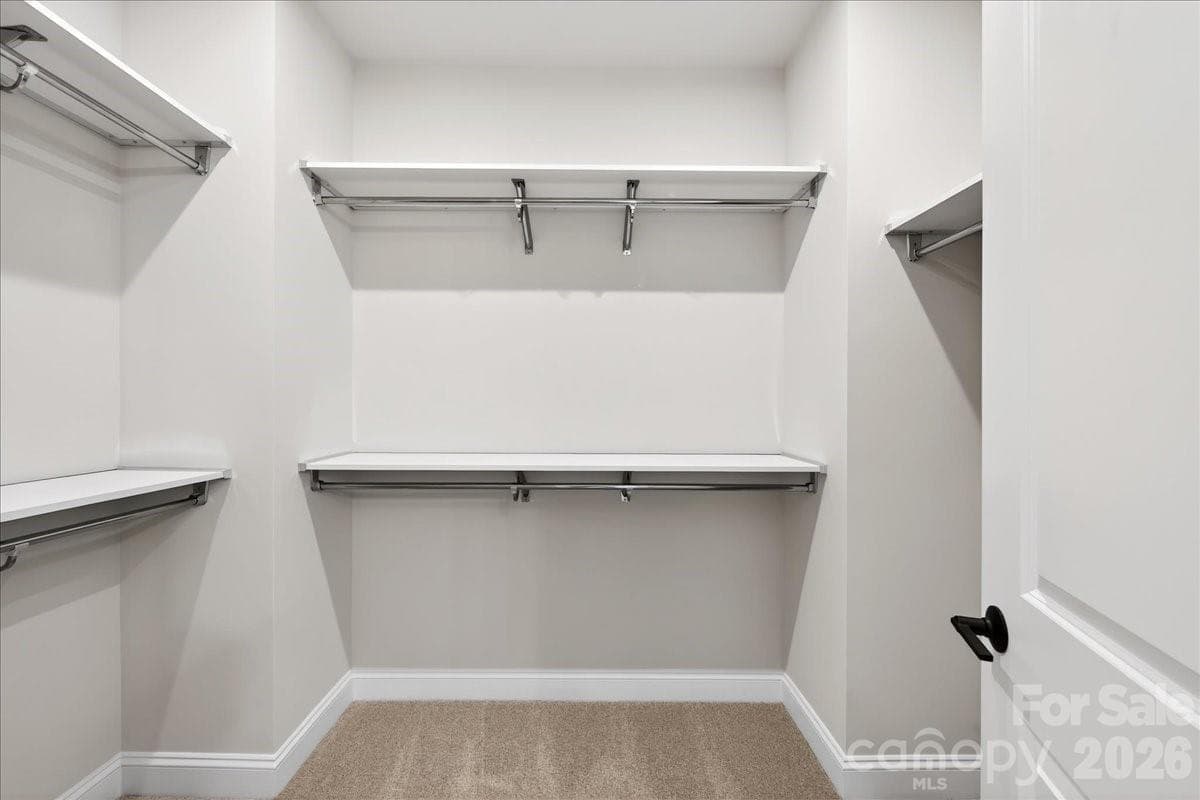 Walk-in closet with upgraded shelving - 420 Old Town Village Road, Waxhaw