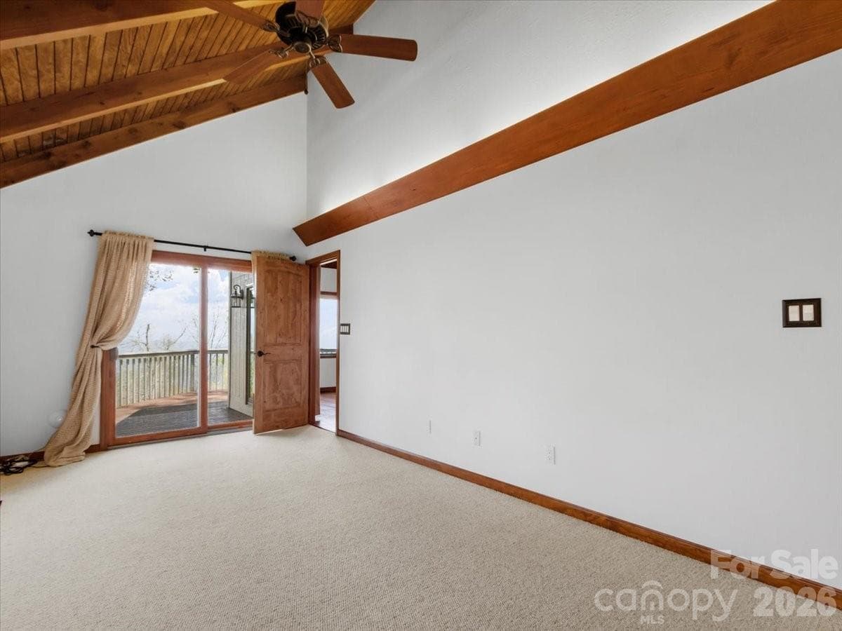 Sliding glass doors from primary bdrm to open deck - 49 Slickrock Ridge Way S, Burnsville