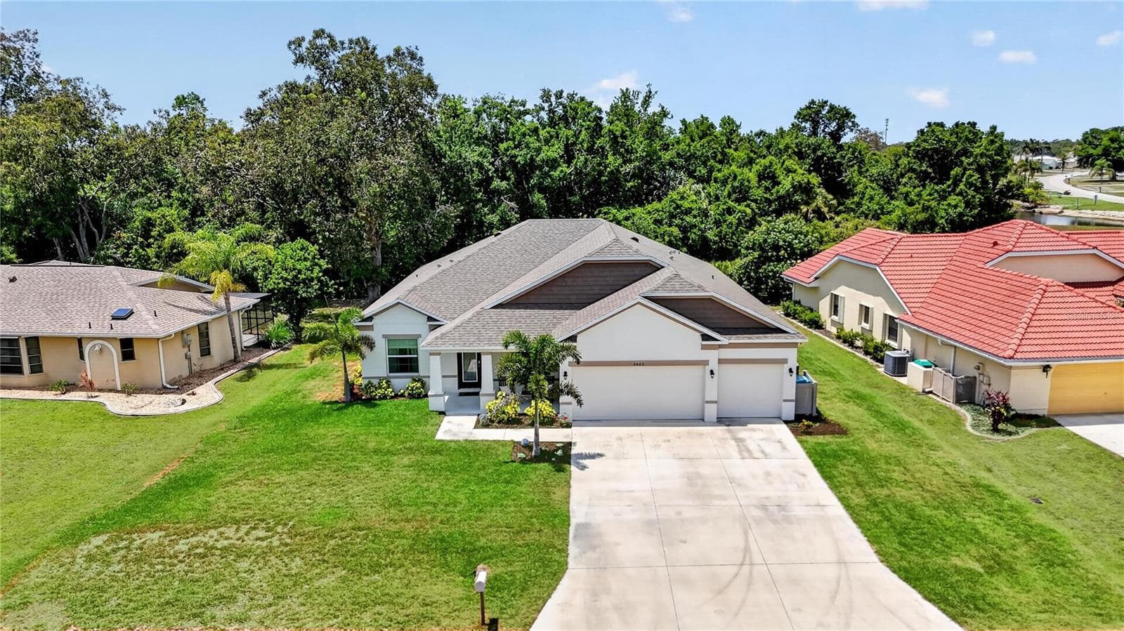 Well maintained and updated St Augustine grass - 2423 MALAYA CT, PUNTA GORDA
