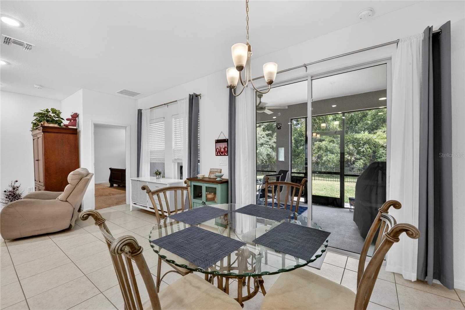 Breakfast nook looking out onto the back porch - 2423 MALAYA CT, PUNTA GORDA