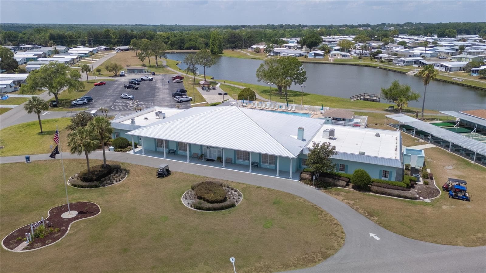 Large clubhouse on the lake with a walking trail - 1502 LONGBOW DR, LAKELAND