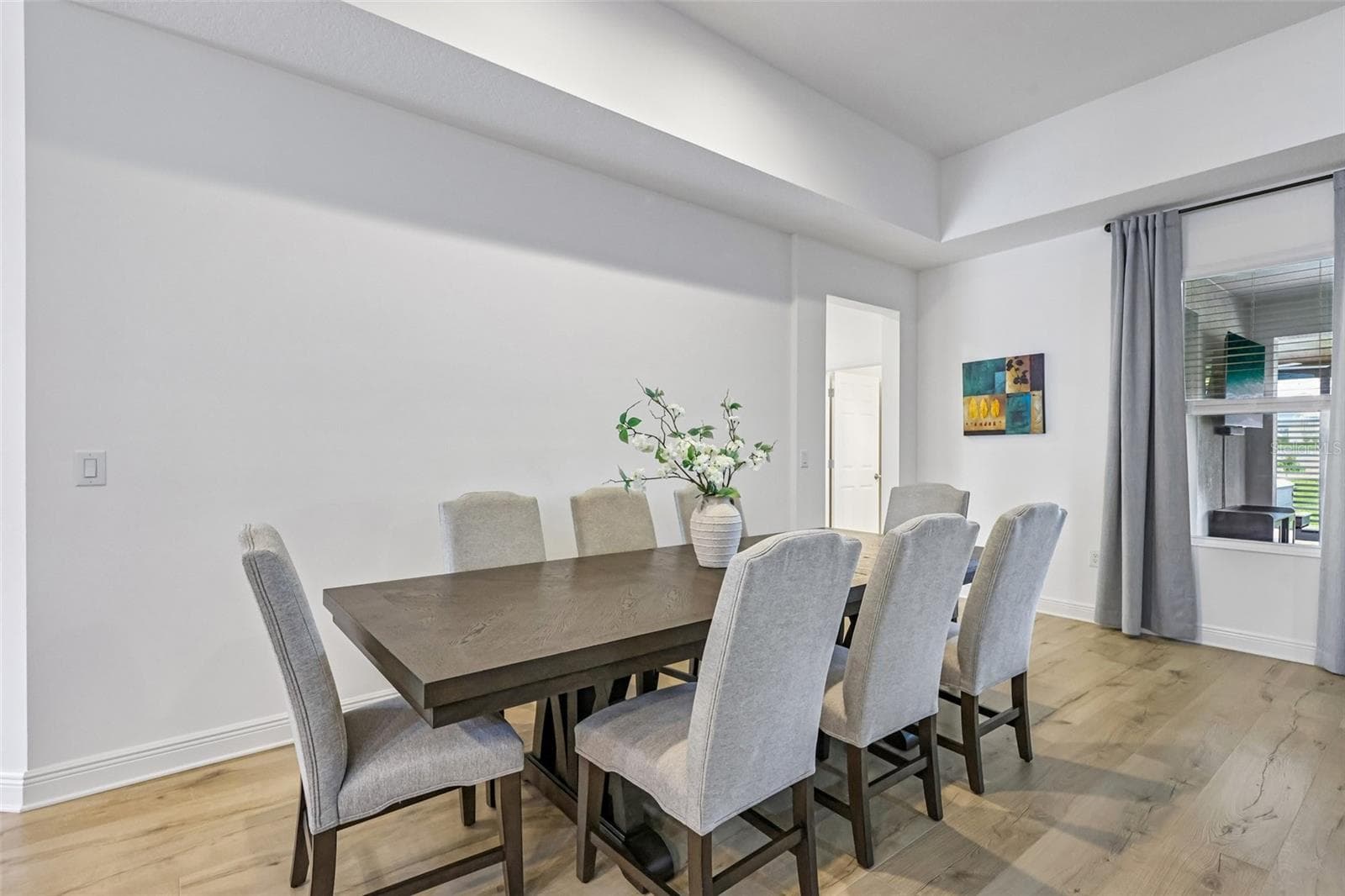 Dining area is open to the kitchen and family room. - 6100 SIERRA CROWN ST, MOUNT DORA