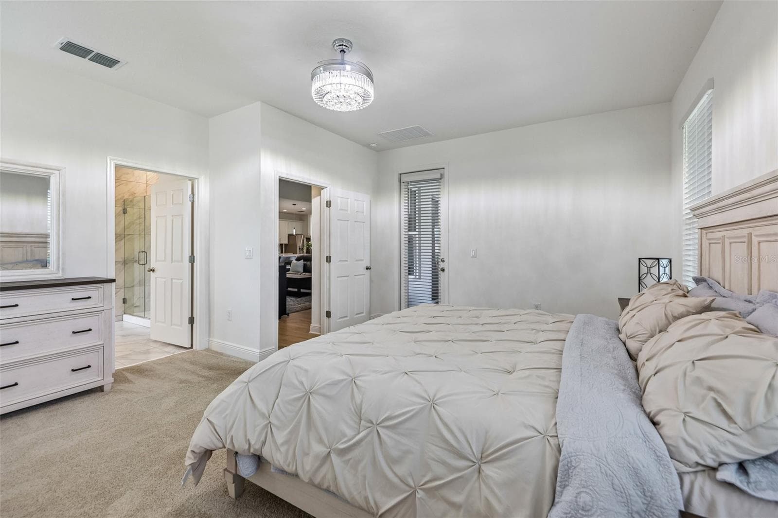The primary suite includes direct access to the lanai. - 6100 SIERRA CROWN ST, MOUNT DORA