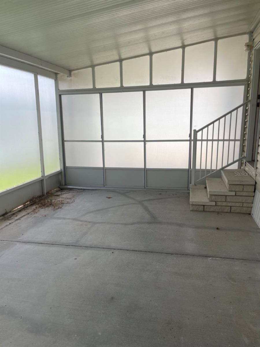 partially enclosed carport with Privacy screen - 152 SHADY LN #152, PALMETTO