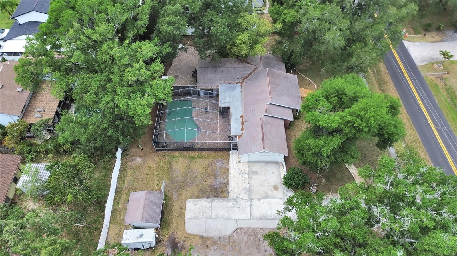 shows inground pool with large screen enclosure, detached concrete block shed, lots of room for parking - 7608 BARRY RD, TAMPA