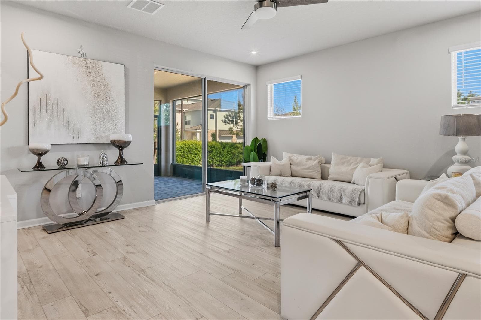 Living room + Screened in patio - 4062 CLOUD HOPPER WAY, LUTZ