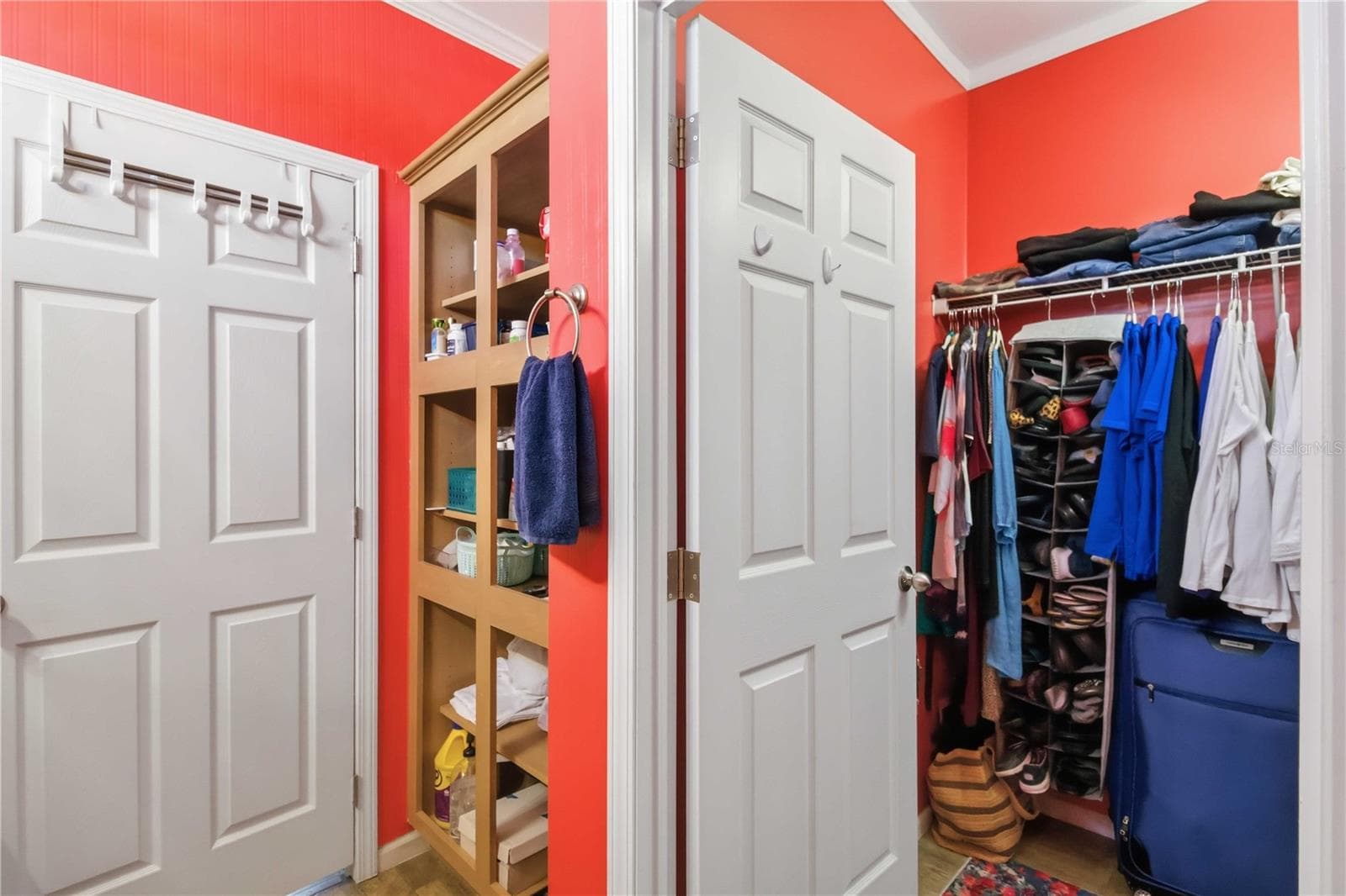 Additional storage behind bathroom door, next to large walk in closet. - 915 50TH AVE W, BRADENTON