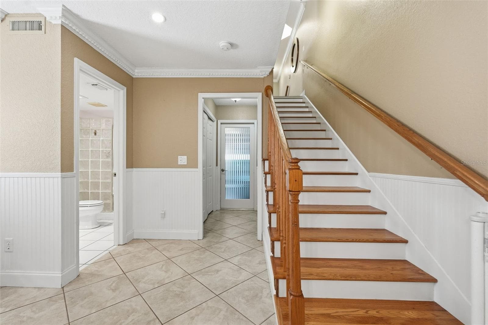 Stairs to 1st Floor: Includes large closet, bathroom with shower and back entry into garage. - 14837 SEMINOLE TRL, SEMINOLE
