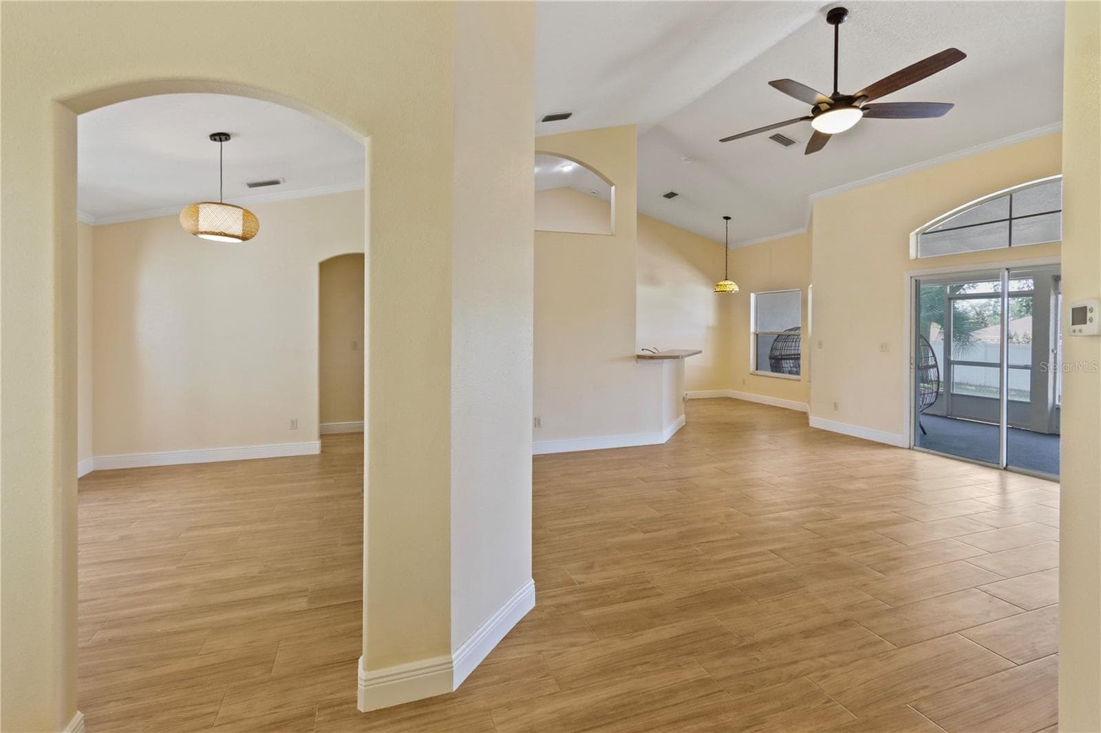 View of dining and living from front door - 10814 VINEYARD CT, CLERMONT