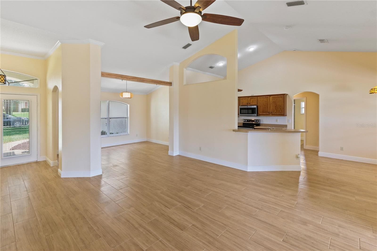 View of living, dining, kitchen from living - 10814 VINEYARD CT, CLERMONT