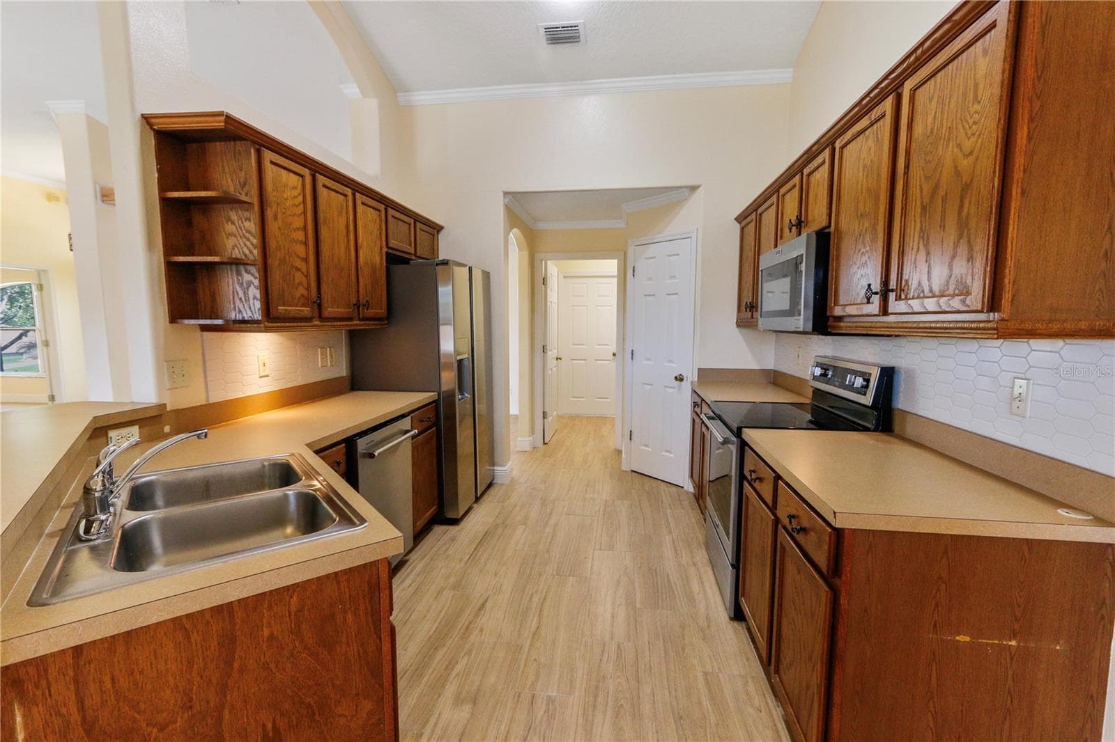 Kitchen, leading to laundry room - 10814 VINEYARD CT, CLERMONT