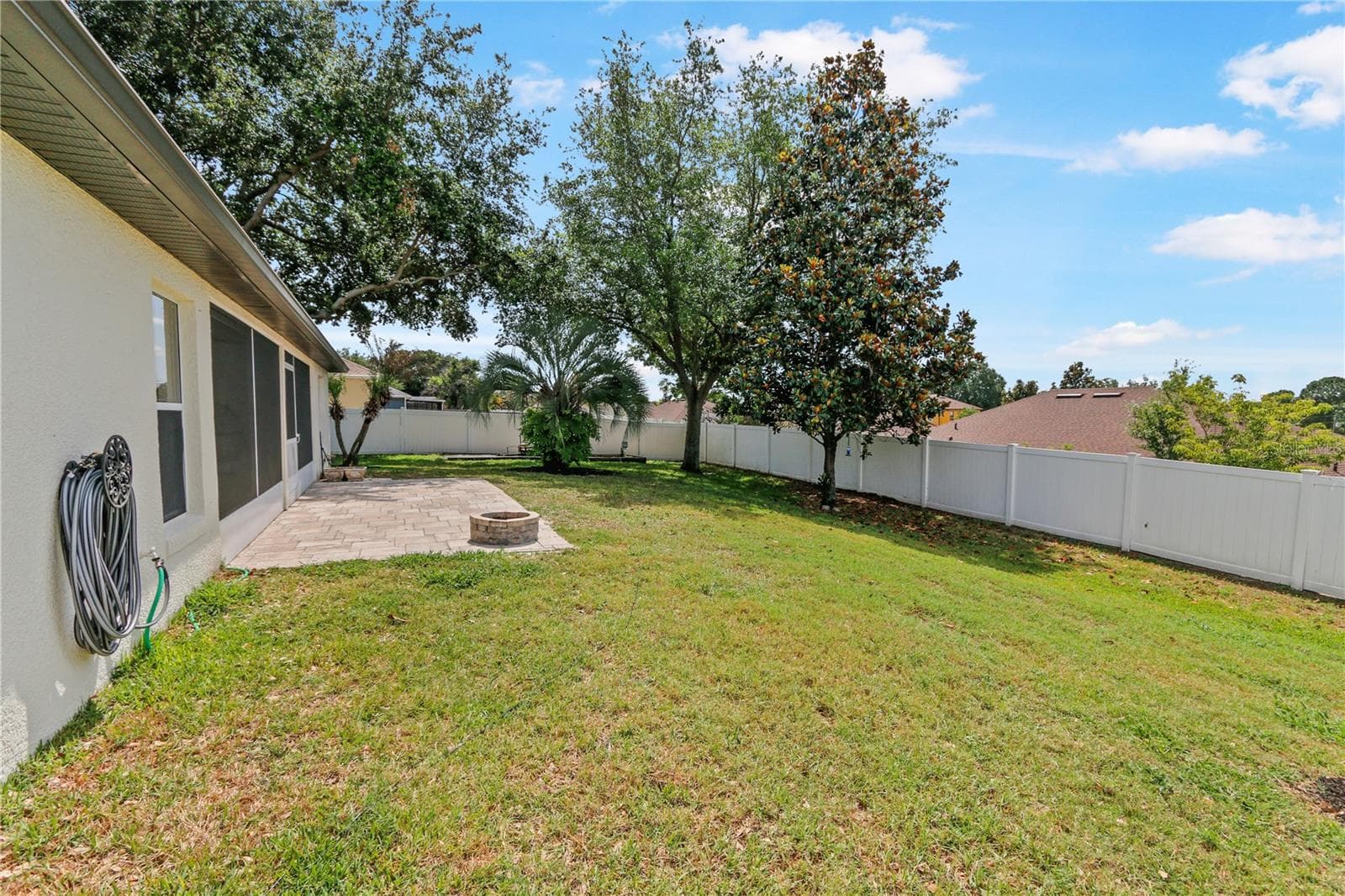 Spacious, fenced yard, paver patio with fire pit - 10814 VINEYARD CT, CLERMONT
