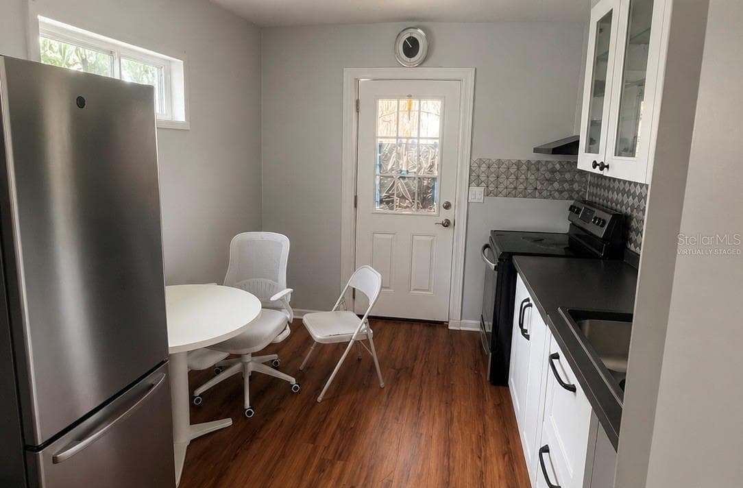 Virtually staged (kitchen to unit B) - 8604 N BRANCH AVE, TAMPA