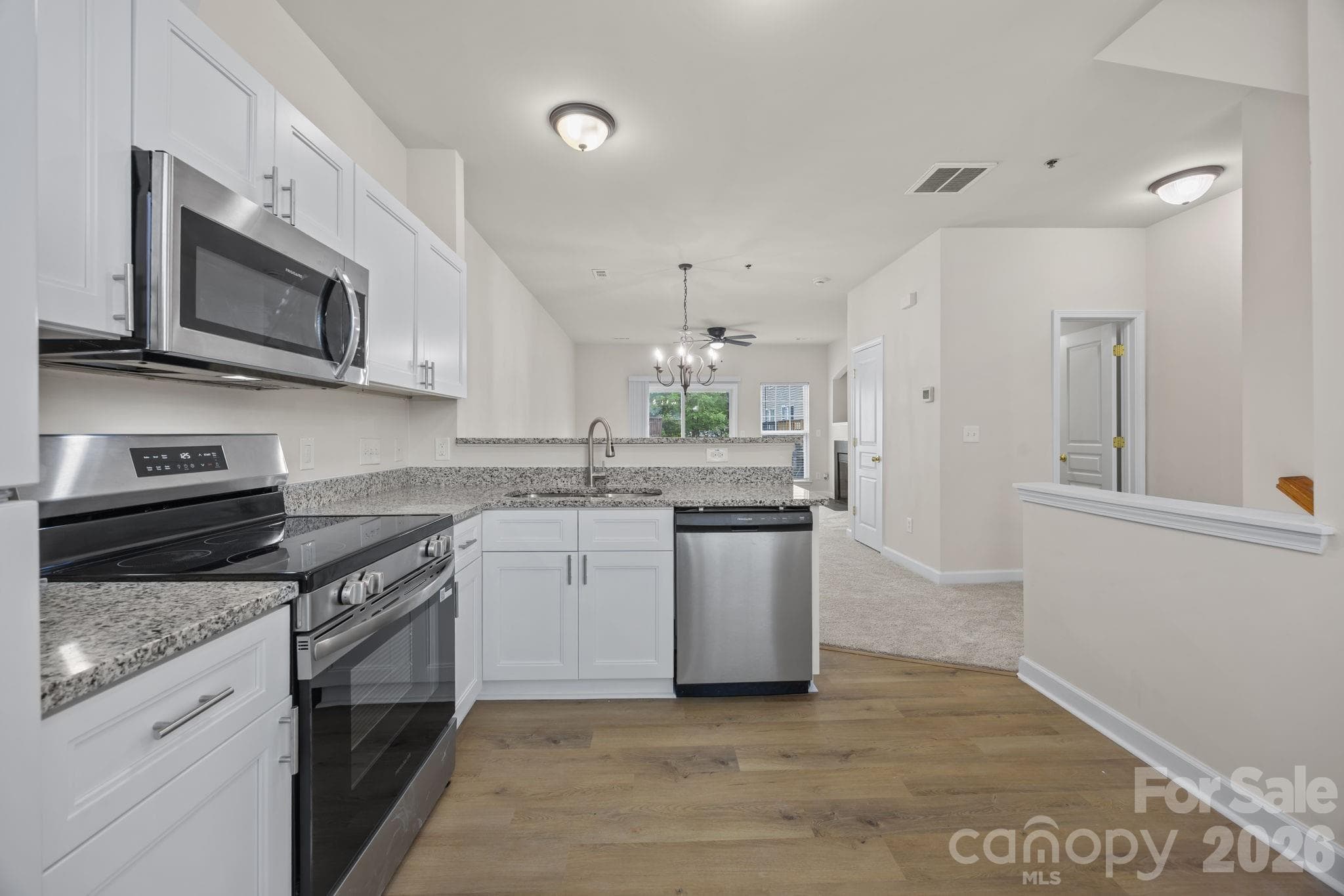 All new and ready for YOU! New cabinets, lighting & flooring. Spacious enough for friends and a small breakfast table. - 2750 Avalon Loop Road, Charlotte
