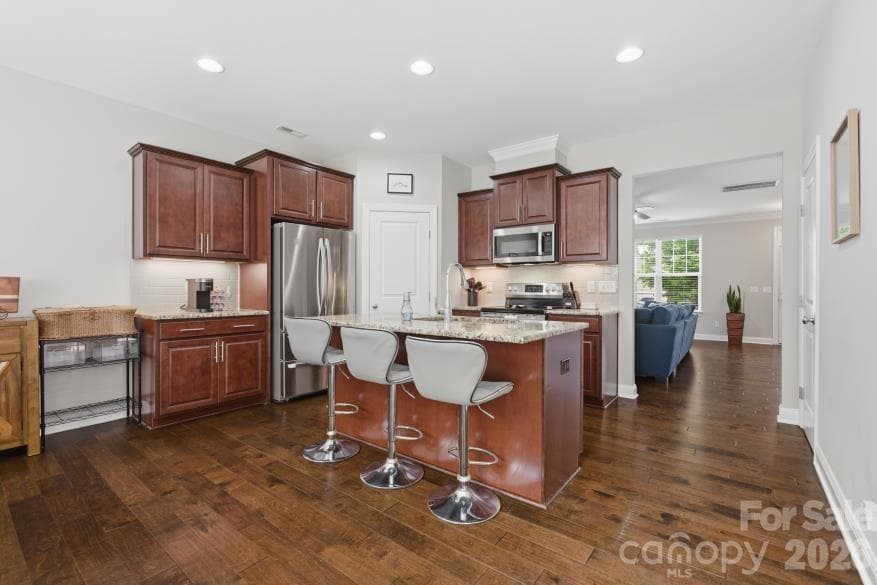 Generous counter and cabinet space in the kitchen, as well as a walk-in pantry in the corner. Even MORE storage in the laundry room! - 8737 Aspinwall Drive, Charlotte