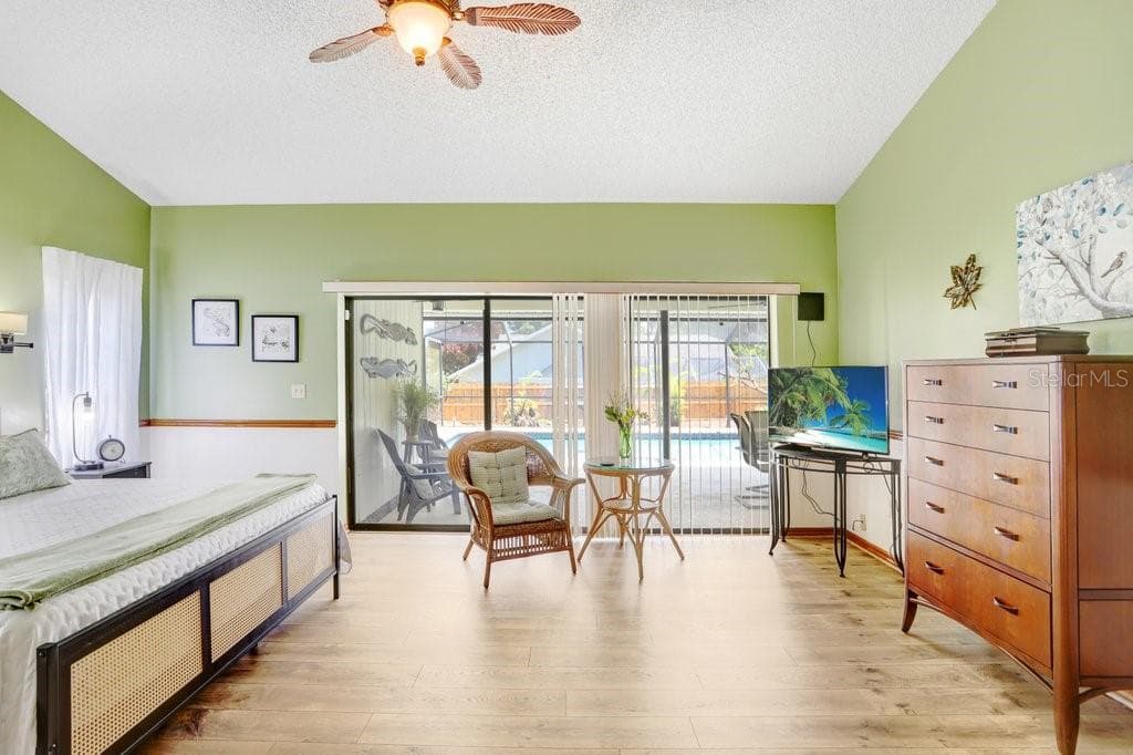 Primary Bedroom with Triple Pocket Sliders - 507 SPORTSMAN PARK DR, SEFFNER