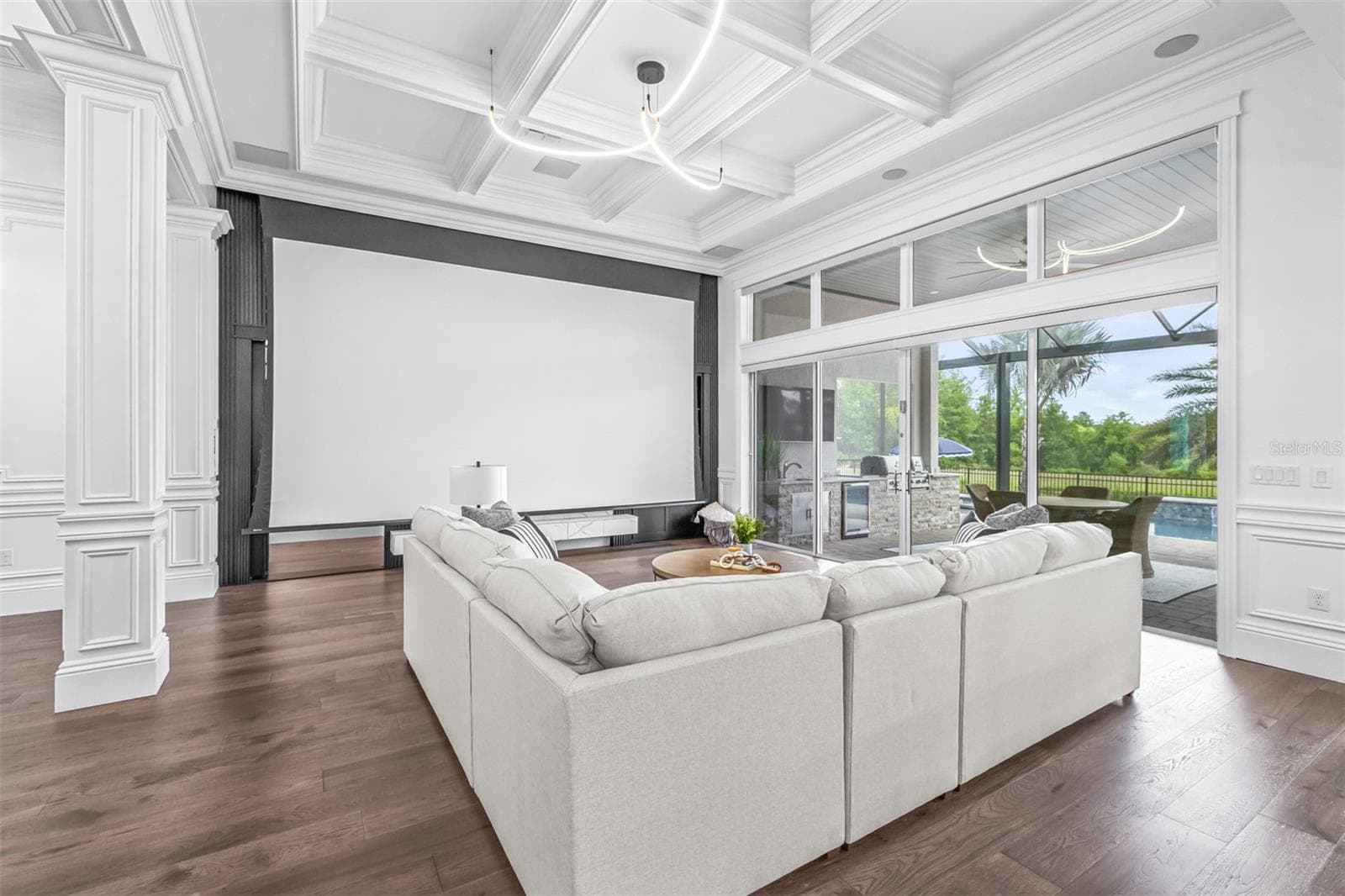 The 220" Drop-Down Screen, Built-in Projector, and Top of the Line Surround Sound Transform the Living Room into Your Own Personal Home Theater - 7190 GRAYBROOK DR, WESLEY CHAPEL