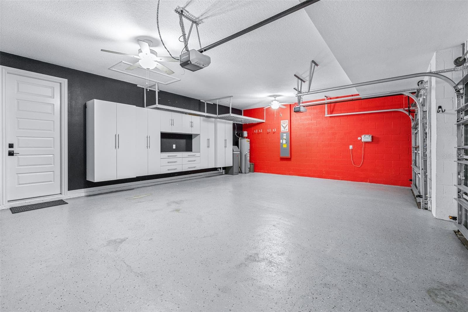 Three Car Garage with Built-in Storage Throughout - 7190 GRAYBROOK DR, WESLEY CHAPEL