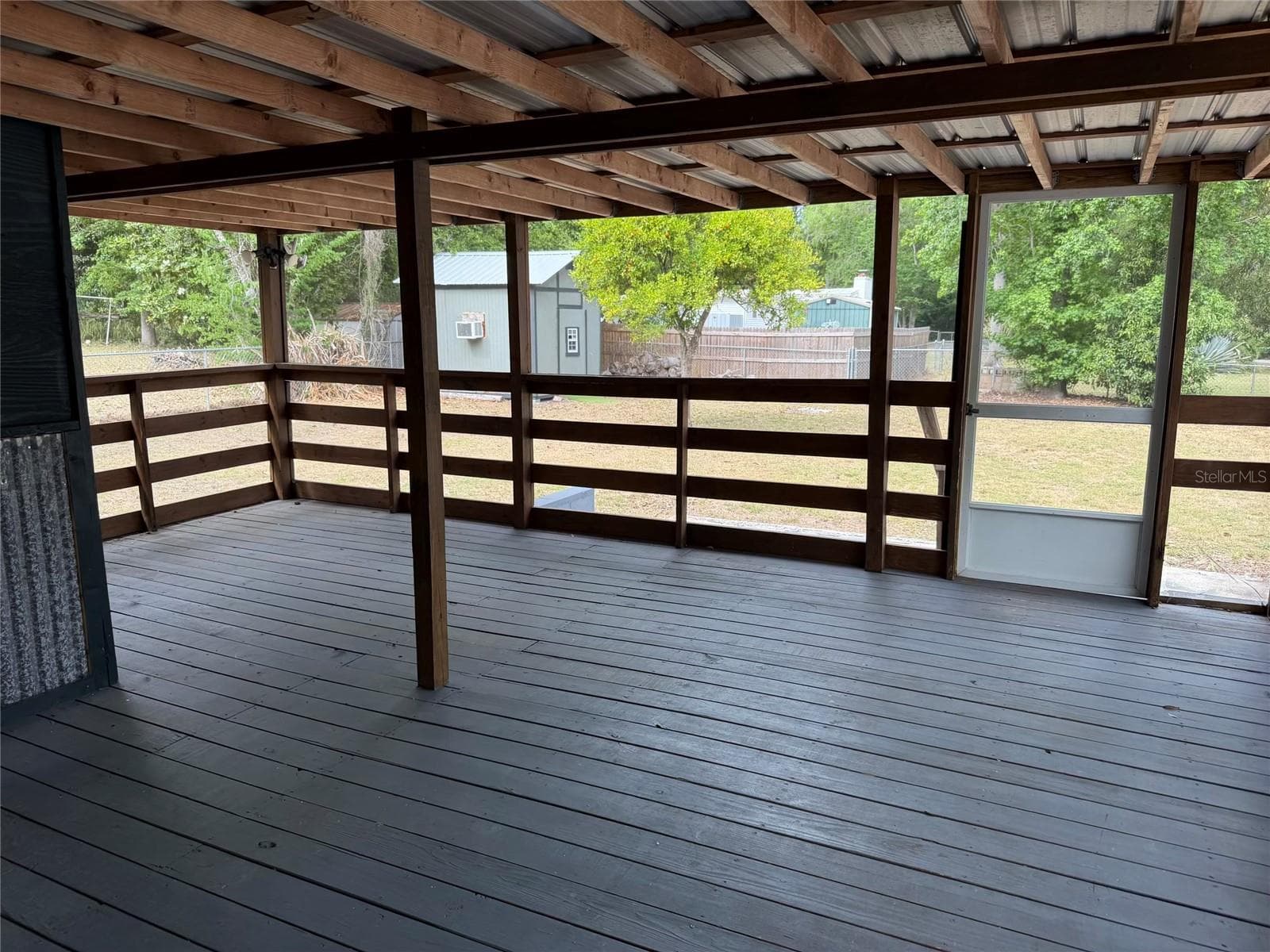 Back patio view 1 - 8732 CR 647 S, BUSHNELL