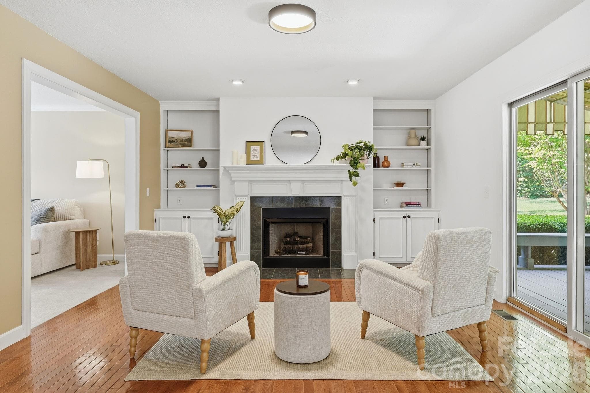 Family room with fireplace open to kitchen - Fletcher