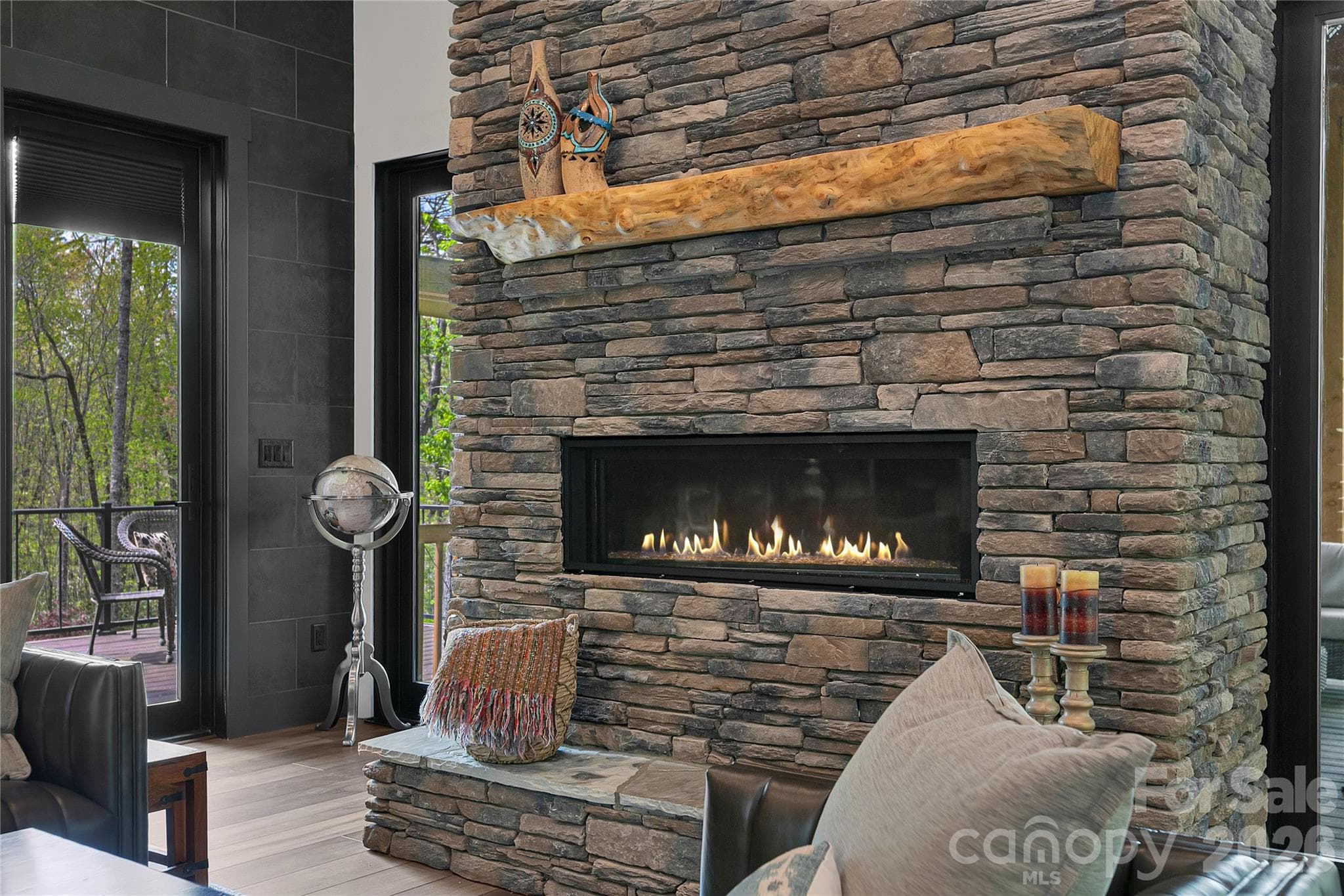 The living room fireplace provides a warm ambiance, suitable for pleasant evenings. - Brevard