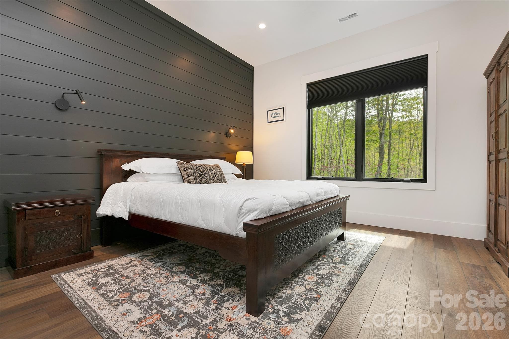 Main level guest bedroom is designed with a private ensuite bath,offering convenience for guest. - Brevard