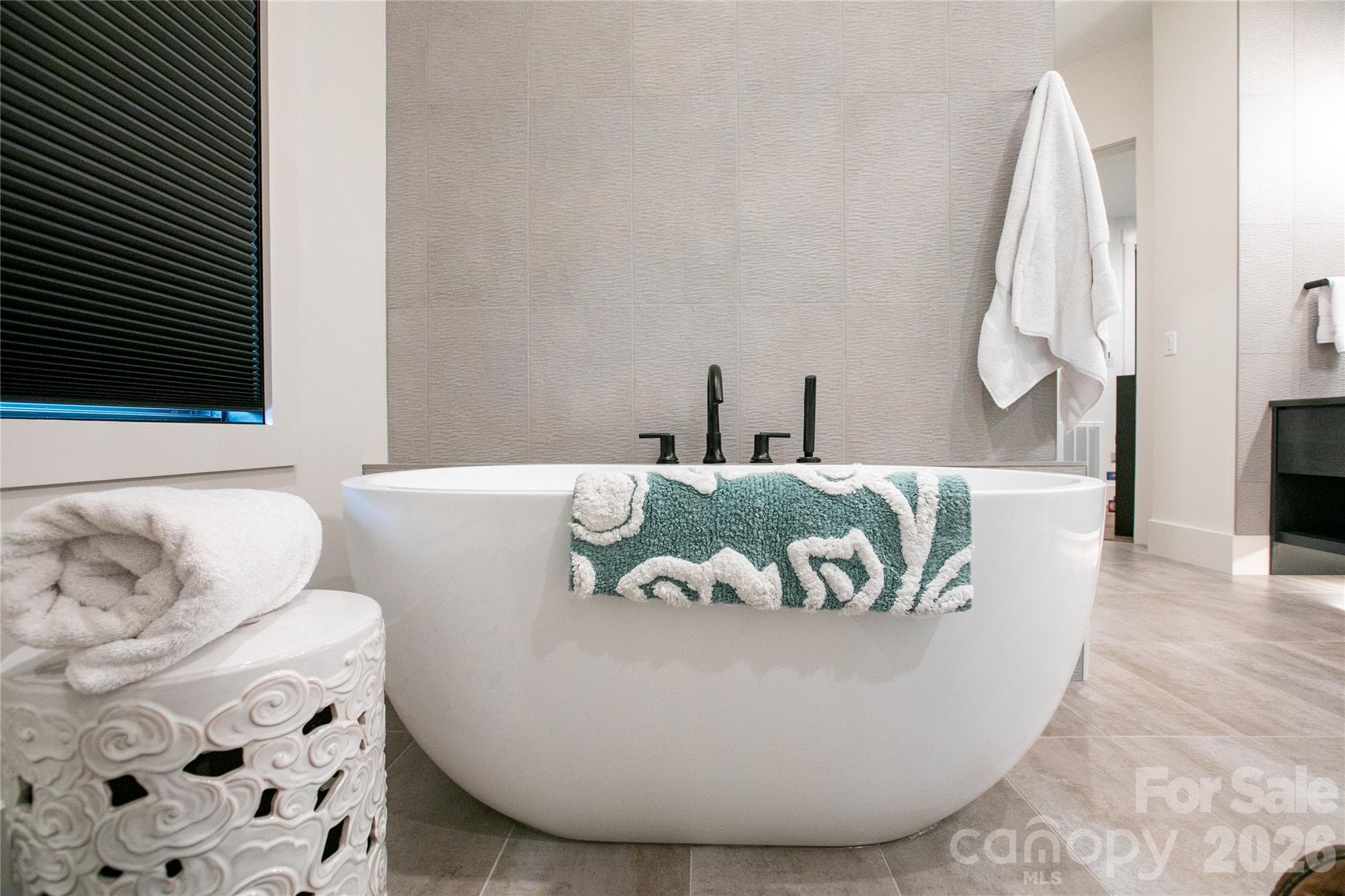 Relax and unwind in the soaking tub after a long day, creating a peaceful spa like retreat. - Brevard