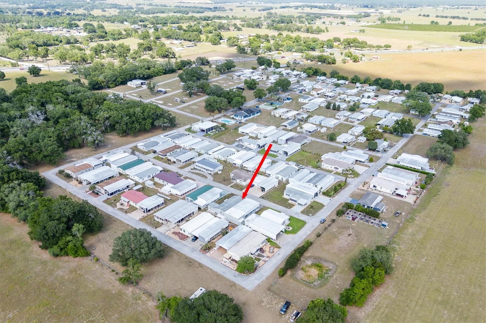 Palm Manor under new ownership of Valleo Homes,  but you do own your own land.  This home sits on one and 1/2 lots,  so has lots of room and even a small yard.  Dogs are allowed. - 10027 EQUITY AVE, DADE CITY