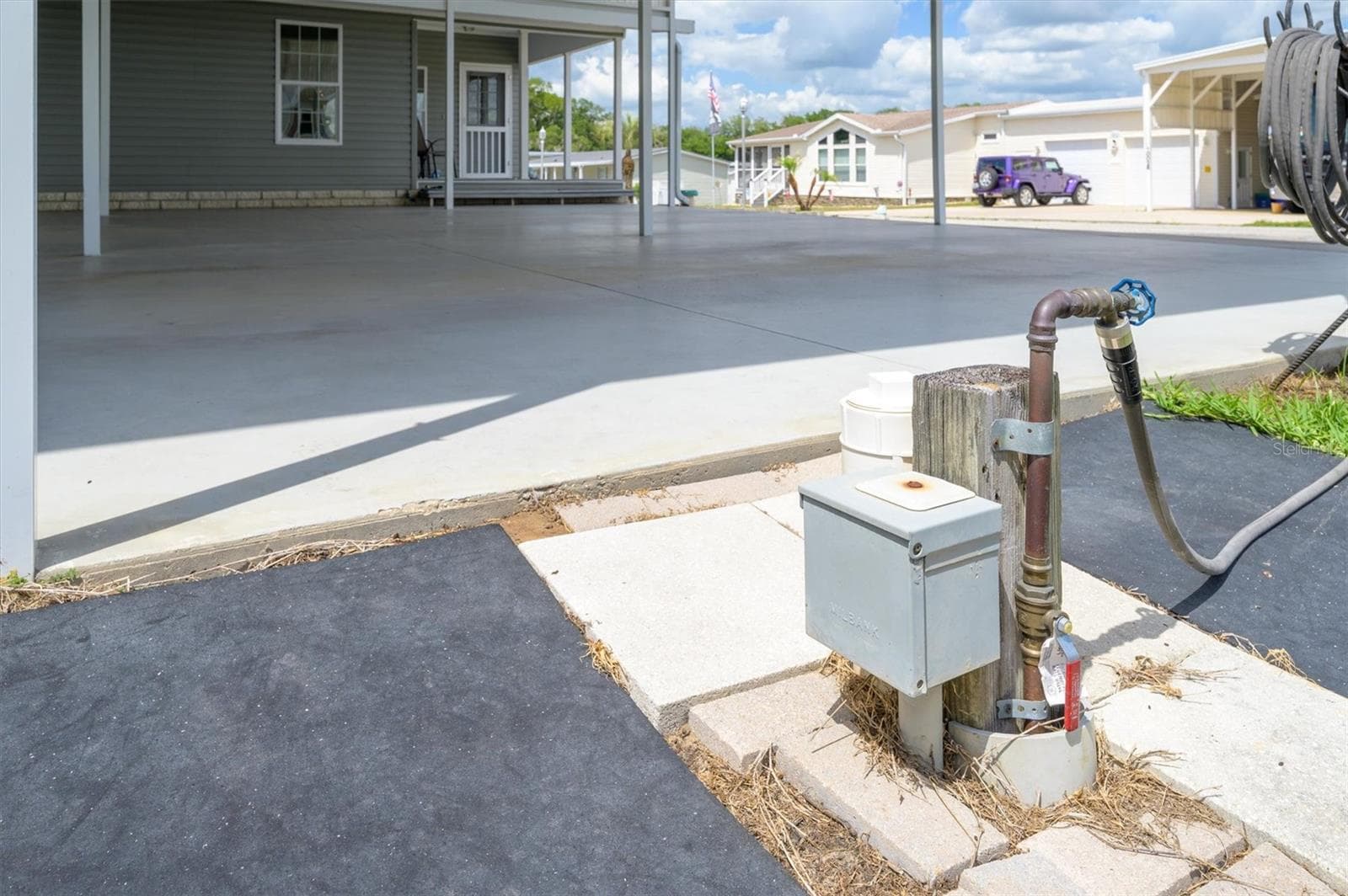 Here is the 50 Amp electrical and pump station for the RV port for hoodups.  This hooks to community sewer system. - 10027 EQUITY AVE, DADE CITY