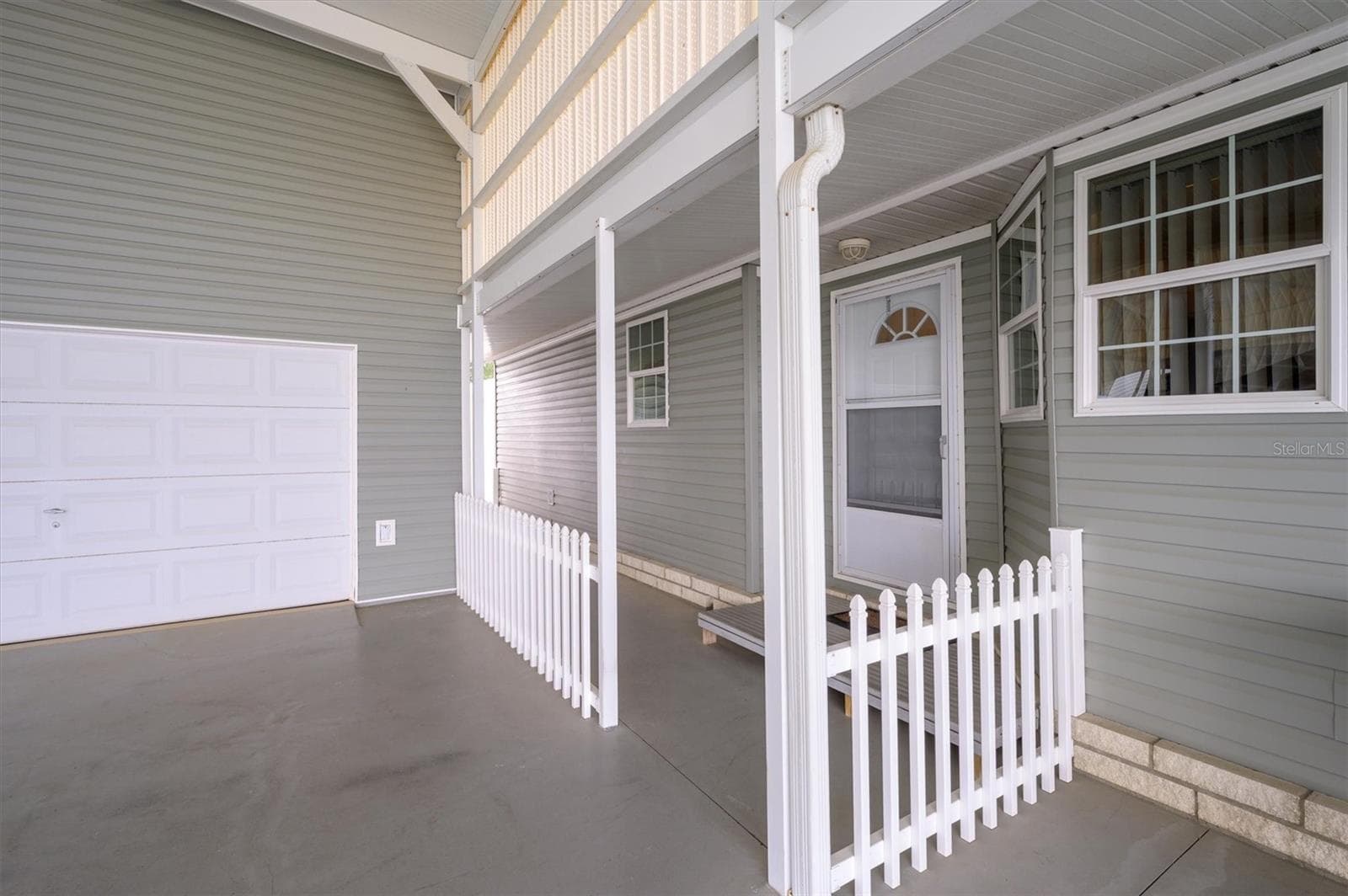Front entrance showing separate garage entry,  which also can be used as flex room, workout room, etc. - 10027 EQUITY AVE, DADE CITY