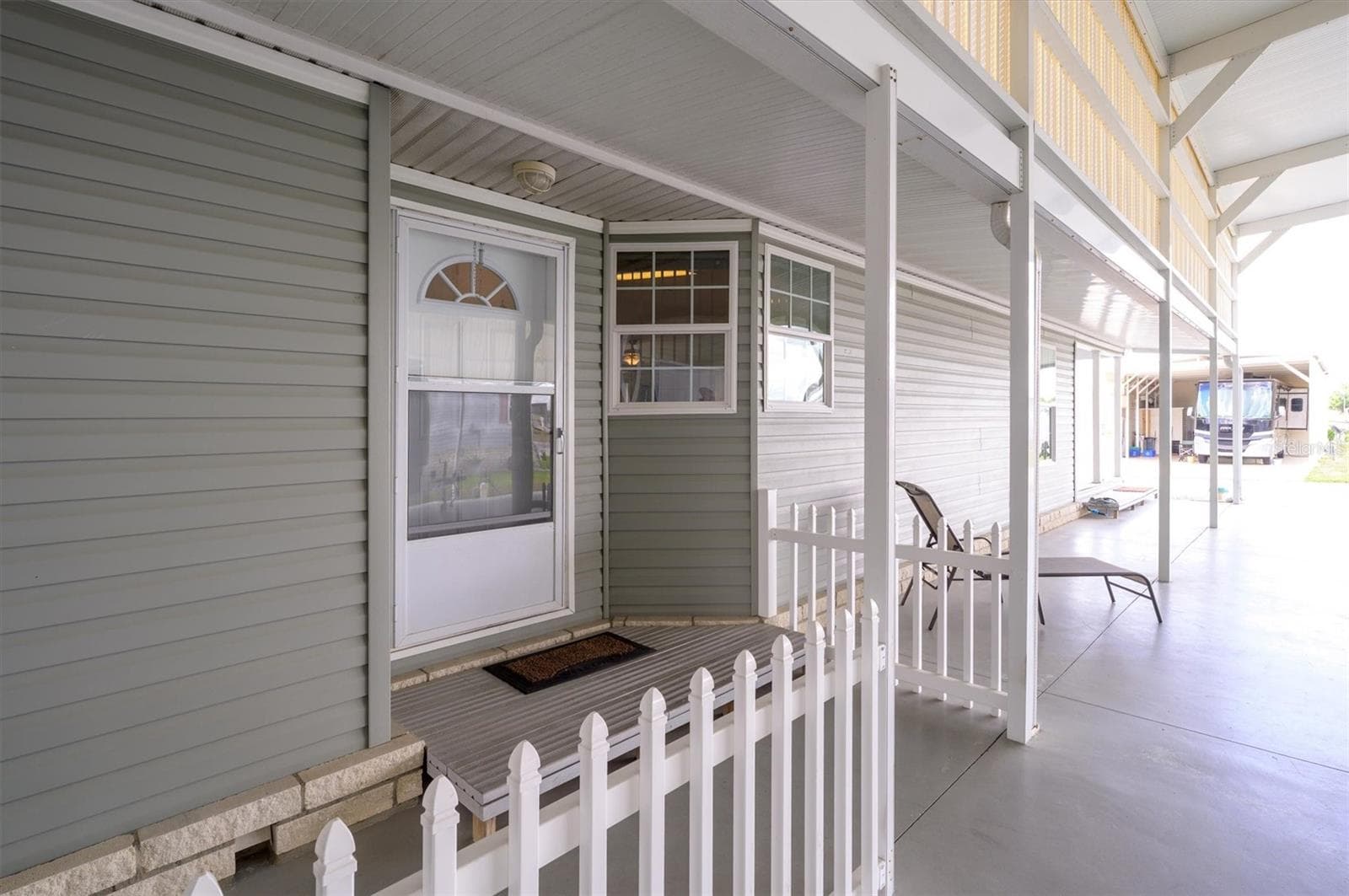 From front door looking out towards road.  So much room for guests to lounge, fun times,  storage, etc. - 10027 EQUITY AVE, DADE CITY