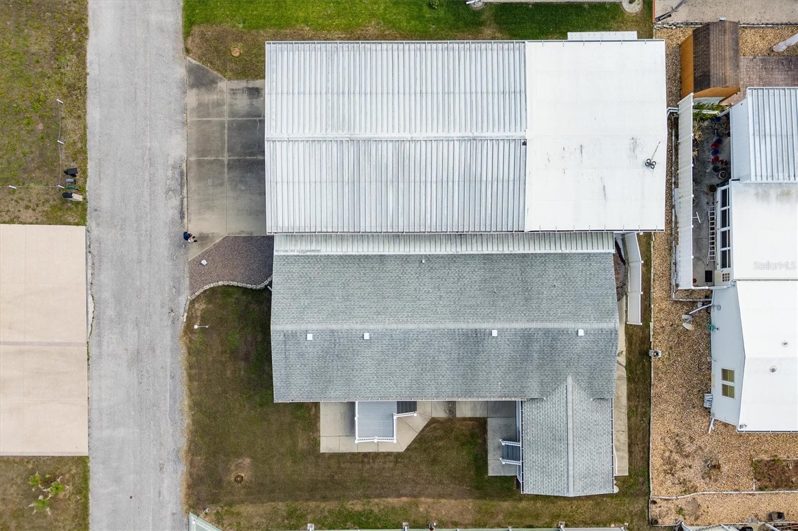 Aerial showing large lot on bottom left.  This used to have an underground wire for dog run .  Was great for their animals. - 10027 EQUITY AVE, DADE CITY