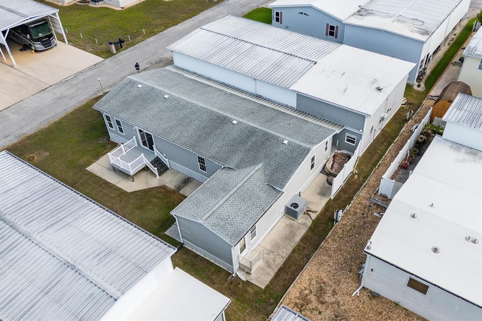 Another view of rear of the property with nice space between neighbors - 10027 EQUITY AVE, DADE CITY