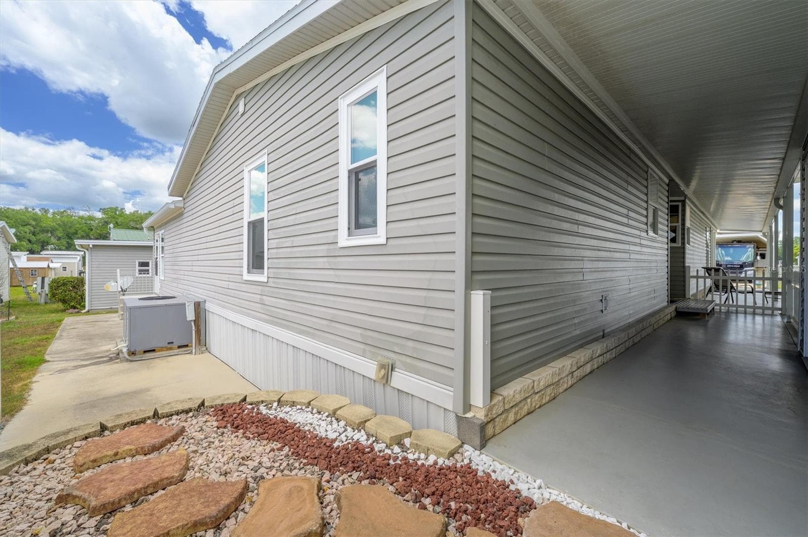 Hallway to backyard .   Owners had small hot tub where pavers are now. - 10027 EQUITY AVE, DADE CITY