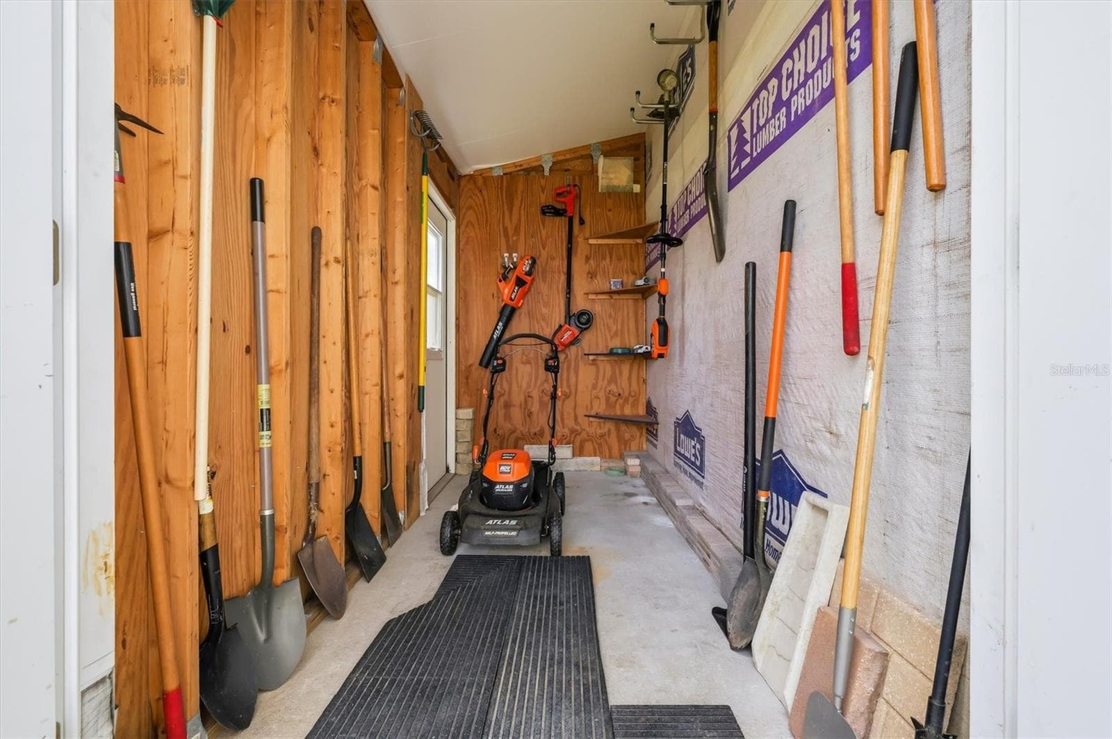 Inside of golf cart and tool shed .  Mower and tools can remain. - 10027 EQUITY AVE, DADE CITY