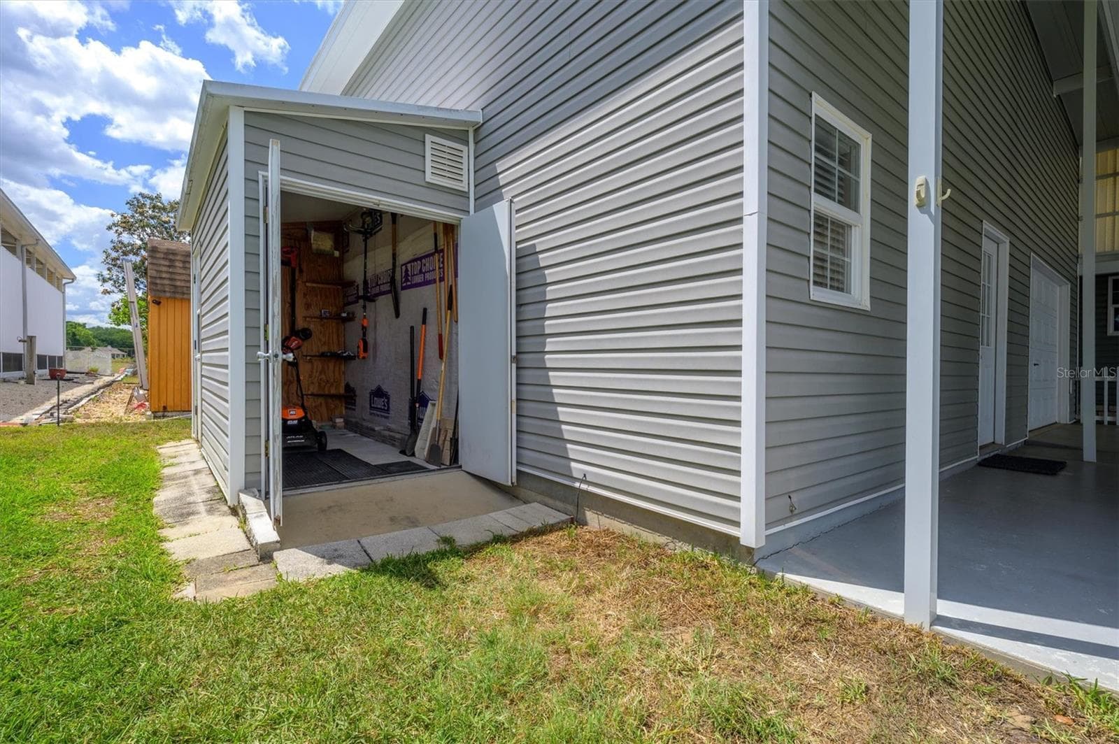 Golf cart and Tool shed.  Mower and tools can remain. - 10027 EQUITY AVE, DADE CITY