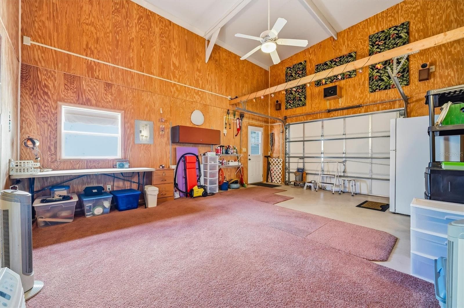Interior of garage side currently used as a workout room and tack room - 10027 EQUITY AVE, DADE CITY